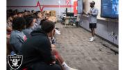 Curtis Knox II, an area scout for the Las Vegas Raiders talk with players and coaches at Arbor View High School.